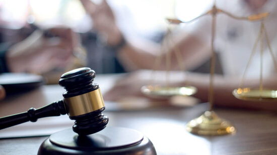 Lawyer or judge gavel with balance handshake