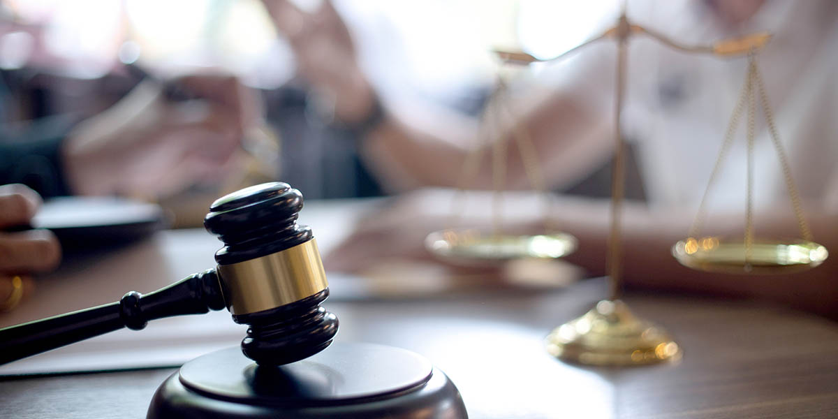 Lawyer or judge gavel with balance handshake