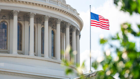 Close-up view of the American Flag on the U.S. Capitol building in Washington D.C. on the East Facade