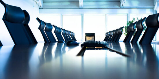 Conference room with large table and many chairs