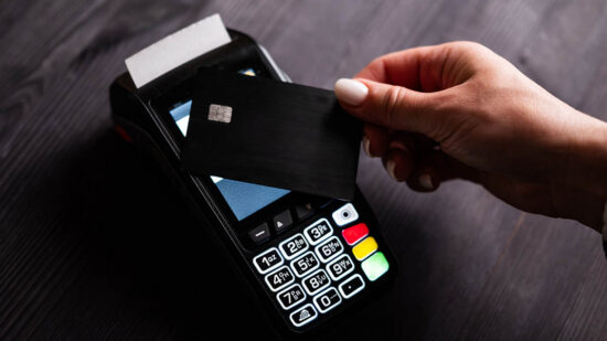 Girl Paying By Credit Card With Wireless Pos Terminal
