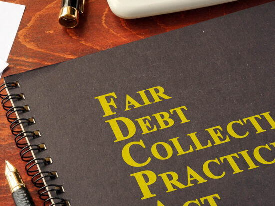 FDCPA Fair Debt Collection Practices Act on a table.