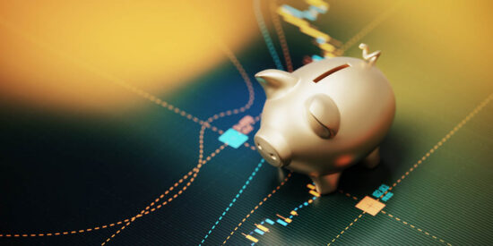 Gold Colored Piggy Bank Sitting over A Bar Graph - Savings Concept